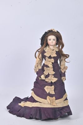 a figurine of a woman in a purple dress