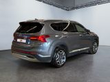 the rear end of a gray suv parked in a garage