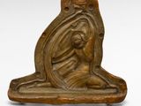 an image of a statue of a woman sitting on a stone block