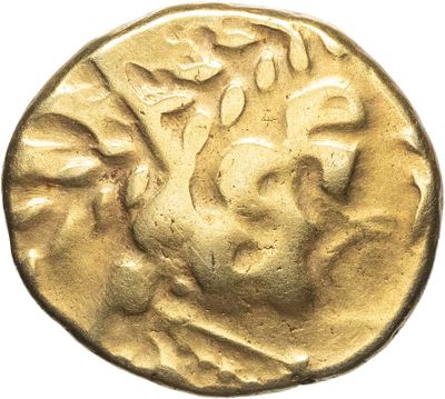 a gold coin with a head of a man on it