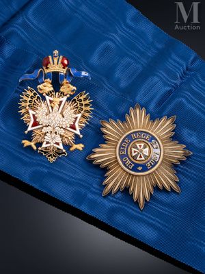 two medals that are laying on a blue cloth