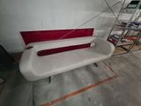 a white and red bench in the middle of a room