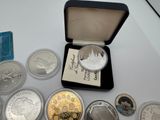 a small box of coins and a card on a table