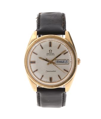 une image représentant une montre dorée et noire avec un cadran blanc