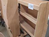 a person standing in a room with a lot of wooden furniture