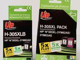 two boxes of up ink ink cartridges sitting on top of each other