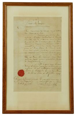 un vieux document portant un cachet de cire rouge