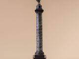 a statue of a man standing on top of a pedestal