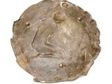an image of a coin with a face on it