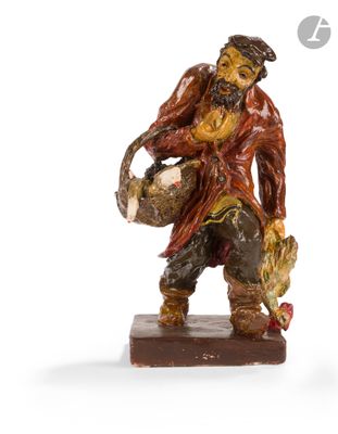 a figurine of a man holding a basket of food