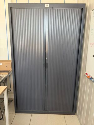two doors that are open in a room