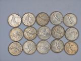 a close up of a bunch of coins sitting on top of a table