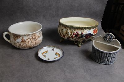three cups and a bowl sitting on a table
