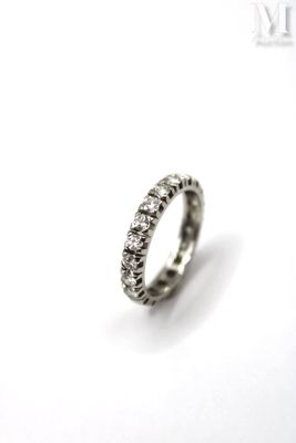 a close up of a silver ring on a white surface