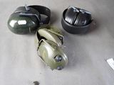 three helmets and a helmet sitting on a table