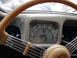 a steering wheel and instrument of a car with a clock