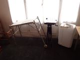 an image of a room with a table and a refrigerator