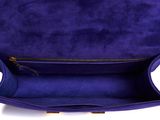 a close up of a purple purse on a white background