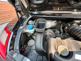 the engine of a car with its hood open and the hood open