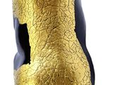 a gold statue of a cat on a white background