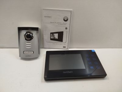 an image of a tablet computer sitting on top of a table next to a camera