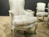 three chairs that are sitting on a wooden floor