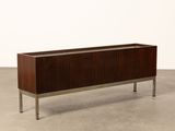 the sideboard is made out of wood and has metal legs