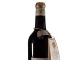 a bottle of wine with a tag on it