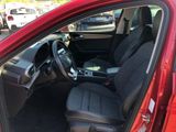 a red car with black seats in the back of it