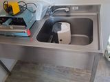 a sink that has a lot of stuff in it