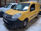 a yellow van that is parked in a garage