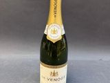 a close up of a bottle of champagne on a table
