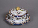 a picture of a fancy blue and white plate with a bird on it