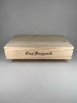 the box is made out of wood and has a name engraved on it