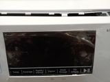 a white washing machine with the door open