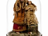 une figurine représentant un homme et une femme sous un dôme en verre
