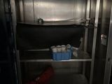 a small refrigerator with a lot of items inside of it