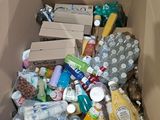 a cardboard box full of food and drinks in it