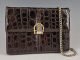 an image of a brown purse with a chain on it
