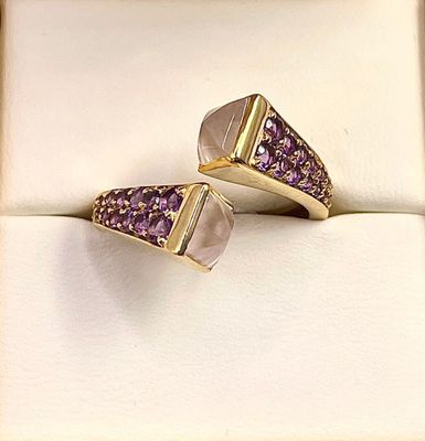 two rings with amethorate and amethorate stones in a box