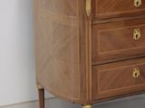 a marble top chest of drawers in a room