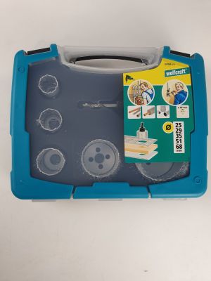a blue tool case with tools in it on a table