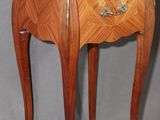 an image of a small wooden table with a drawer on it