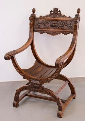 a wooden chair that is sitting in a room