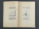 an open book on a table with a drawing of a square and a triangle