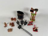 a small collection of toys and tools on a white surface
