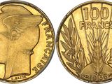 a close up of a gold coin with a woman ' s head on it
