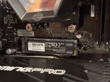 a close up of a computer motherboard with a hard drive attached to it