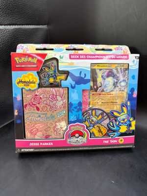 a box of pokemon toys sitting on top of a black surface