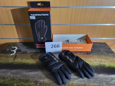gloves are on a table with a box of gloves on it